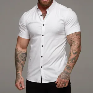 Detailed view of men's white muscle fit stretch shirt featuring contrasting black buttons