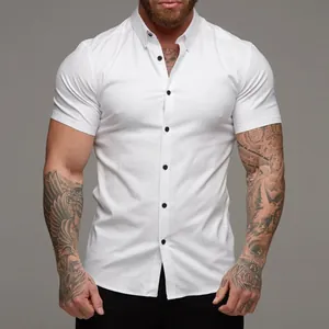 Front view of a slim-fit white short-sleeve shirt on a muscular male model.