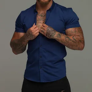 Muscle fit navy blue short sleeve stretch shirt for men with button-up collar design.