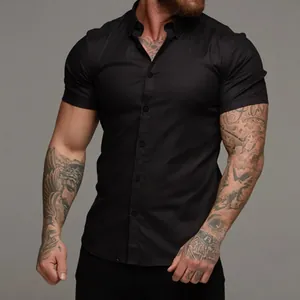 Detail of men's slim fit black short sleeve muscle shirt with stretchy premium fabric