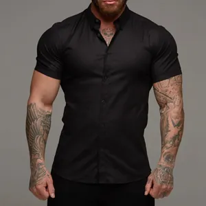 Muscle fit men's black short-sleeve stretch shirt with button-up collar detail view.