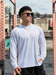 Close-up of men's white mesh sports top showing raglan sleeves and breathable fabric
