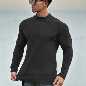 Detail shot of men's slim-fit muscle t-shirt with premium texture and mock neck