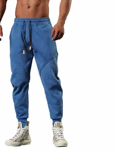 Men's blue fleece-lined sports sweatpants with adjustable drawstring and jogger cuffs