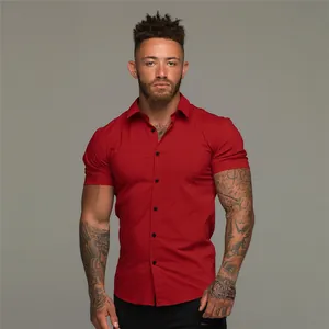 Professional front view of a slim fit men's red short sleeve stretch muscle fitness shirt