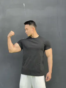 Athletic fit charcoal men's t-shirt showing fabric texture and muscular silhouette