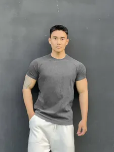 Detailed shot of a premium men's athletic charcoal grey cotton crew neck t-shirt
