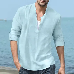 Close-up of men's light blue linen Henry shirt with stand collar and long sleeves for beach