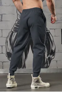 Detailed back view of men's loose cuffed joggers for gym training and outdoor running