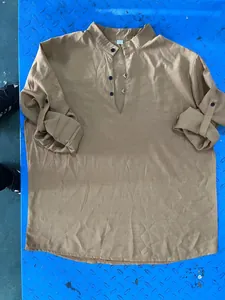 Casual men's khaki linen Henley shirt with stand collar and button detail flat lay