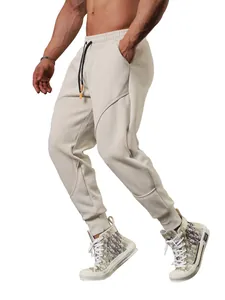 Professional men's cream athletic joggers featuring 3D stitching and adjustable drawstring