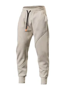 Men's casual sports joggers in beige with 3D spliced seams and tapered cuffs for gym
