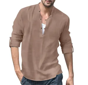 Detail of men's khaki linen Henley shirt with stand collar and rolled-up sleeves.