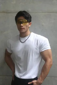 Athletic male model wearing a white heavyweight Sorona crew neck slim fit gym t-shirt