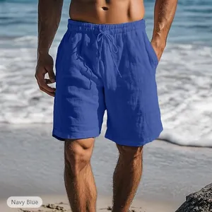 Detail view of men's navy blue cotton linen shorts with a drawstring elastic waist.