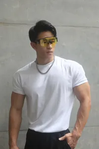 Front view detail of a heavyweight white crew neck gym T-shirt worn by an athletic male model