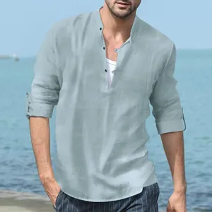 Close-up of men's light blue linen Henley shirt featuring stand collar and texture.