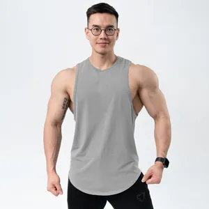 Detailed view of a grey cotton sports tank top on a muscular male model in a studio