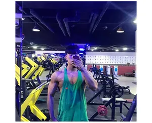 Green cotton breathable gym tank top for men shown in a fitness center