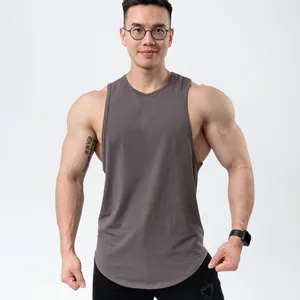 Fit of grey cotton sports tank top on a muscular male athlete for gym training