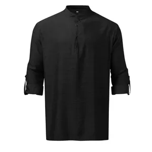 Close-up of a black men's linen Henley shirt with stand collar and roll-up sleeves