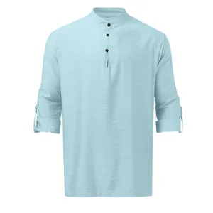Detailed view of light blue men's linen Henley shirt featuring stand collar and roll-up sleeves