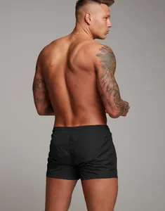 Rear view of men's black athletic shorts showing back fit and breathable fabric detail