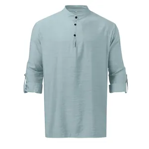Detail view of light blue men's linen henley shirt with stand collar and buttoned placket