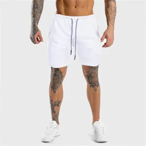 Pantaloncini sportivi bianchi da uomo ad asciugatura rapida con coulisse e riflettente