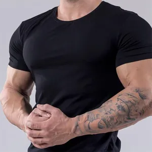 Detail of men's slim fit athletic black t-shirt showing muscle definition