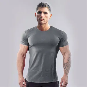 Slim fit grey athletic t-shirt showing muscle definition and stretch fabric detail