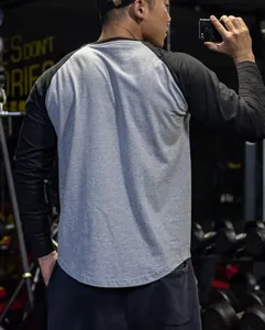 Rear view of mens raglan long sleeve gym shirt showing athletic fit and breathable fabric