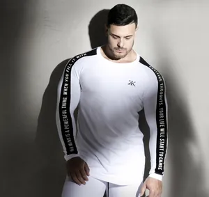 Detail view of men's white quick-dry long sleeve fitness shirt with sleeve text