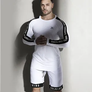 High-performance white long-sleeve fitness shirt featuring athletic sleeve print details