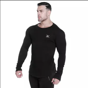 Front view of men's black long-sleeved compression fitness shirt with chest logo