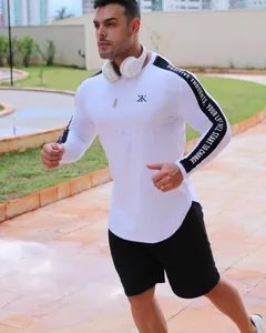 Close-up of men's breathable quick-dry compression long sleeve gym top with sleeve text