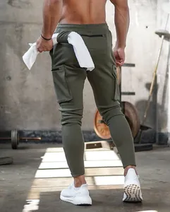 Back view of olive green slim fit cargo joggers for men during a gym workout session
