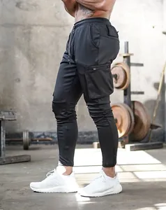 Side view of black slim-fit athletic cargo joggers with zippered side pocket detail