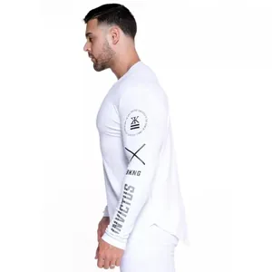 Close-up of white men's compression fitness shirt with sleeve graphics and logo
