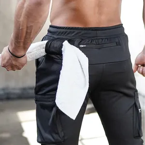 Detail view of men's athletic joggers featuring a functional back towel loop