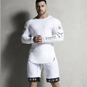 Men's white quick-dry compression gym shirt with long sleeves and athletic fit