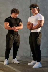 Tight fit muscle t-shirt and sports joggers for men's fitness training by Youngla