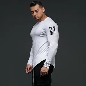 Close-up of white muscle fit long sleeve gym shirt with unique 77 number print on sleeve