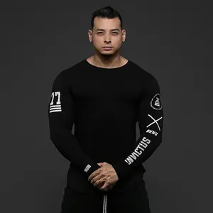 Detail of men's black compression long-sleeve gym shirt with Invictus sleeve graphics