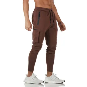 Detailed view of men's brown multi-pocket cargo sweatpants for fitness and running