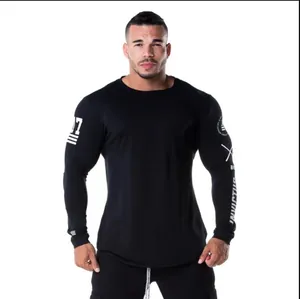 Detailed view of athletic fit long-sleeve gym shirt on a professional male muscle model