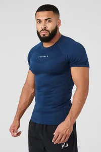 Detail view of navy blue high-elastic compression gym t-shirt on a muscular male model.