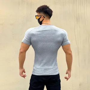 Back view of a grey muscle fit ribbed t-shirt showing the slim elastic design