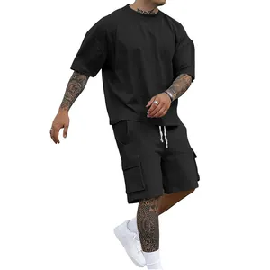 Men's casual black sports set featuring short sleeve t-shirt and cargo shorts on model