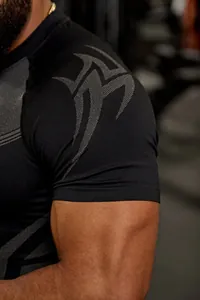 Detail of men's high elastic black compression gym shirt with shoulder pattern